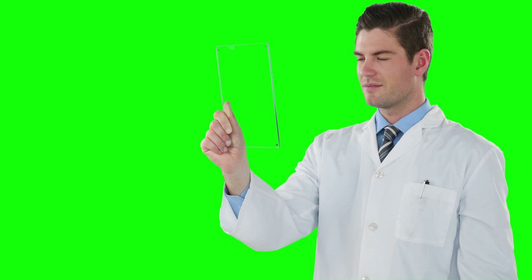 Scientist Analyzing Transparent Specimen Against Green Screen - Free Images, Stock Photos and Pictures on Pikwizard.com