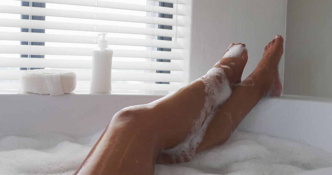 Woman Relaxing in Bathtub with Foam and Natural Light - Free Images, Stock Photos and Pictures on Pikwizard.com