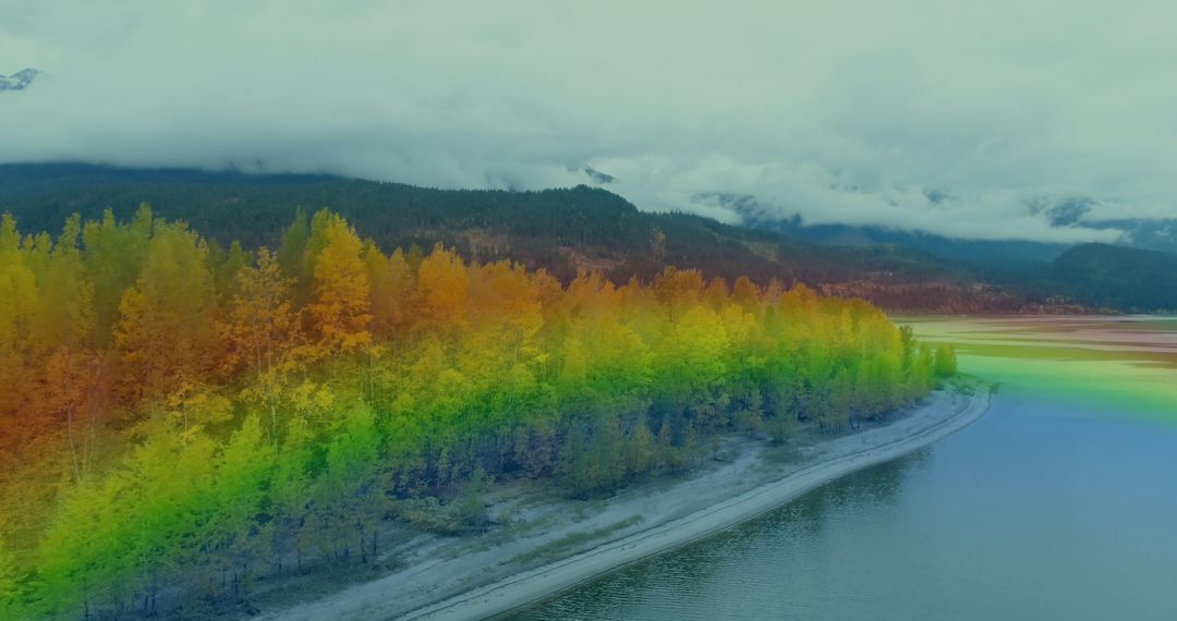 Vibrant Rainbow Fog Over Forested Riverbank Scenery
