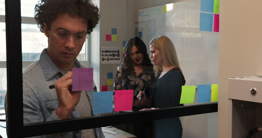 Creative Team Collaborating and Brainstorming Ideas in Office