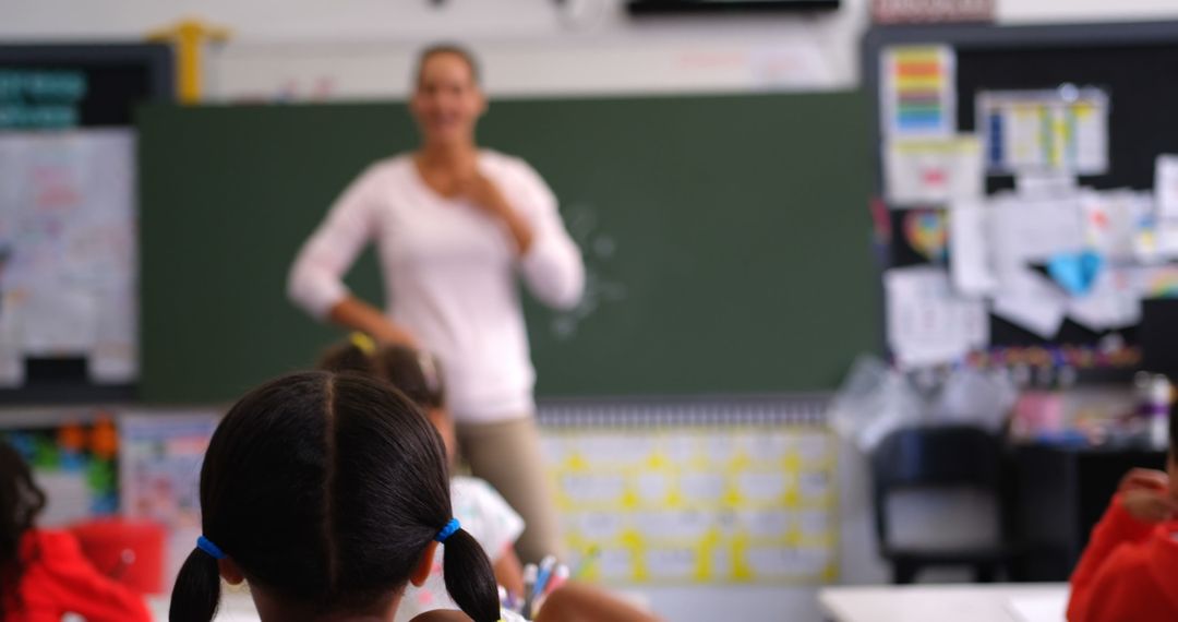 Teacher Engaging Children in Classroom Discussion - Free Images, Stock Photos and Pictures on Pikwizard.com