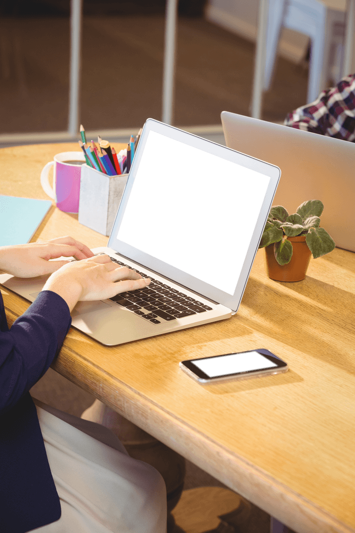 Transparent Black Screen Laptop in Office with Coffee