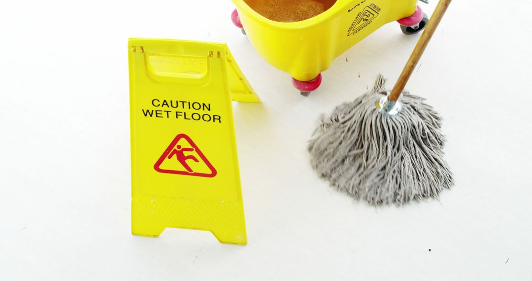 Yellow Caution Wet Floor Sign with Mop and Bucket for Safety Awareness - Free Images, Stock Photos and Pictures on Pikwizard.com