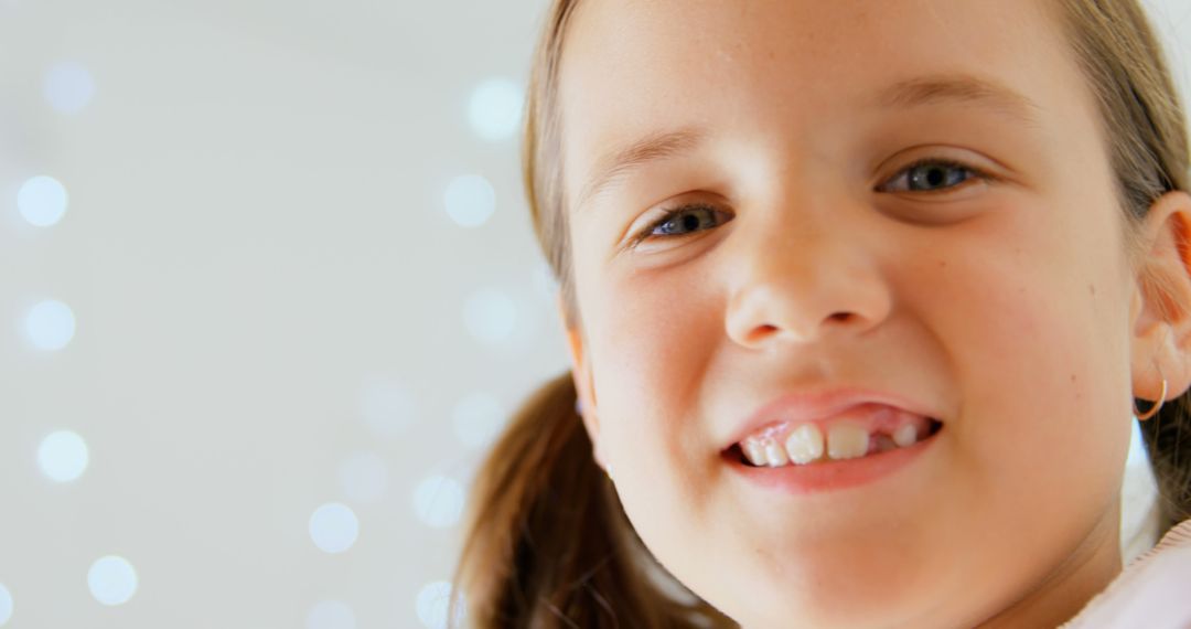 Joyful Girl Smiling in Soft Light with Out of Focus Background - Free Images, Stock Photos and Pictures on Pikwizard.com