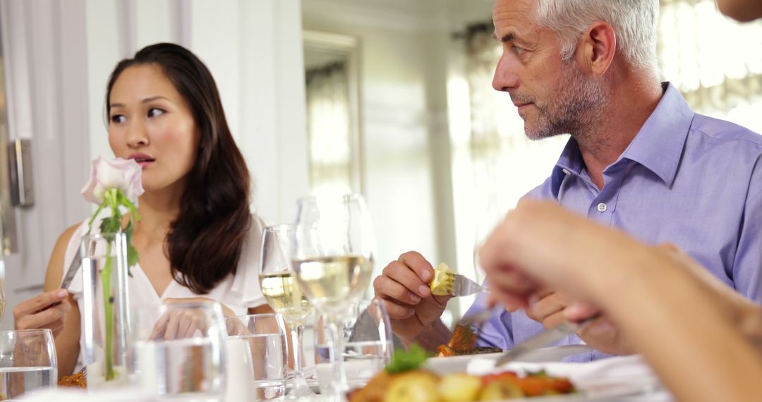 Group of Friends Enjoying Dinner at a Cozy Restaurant Setting