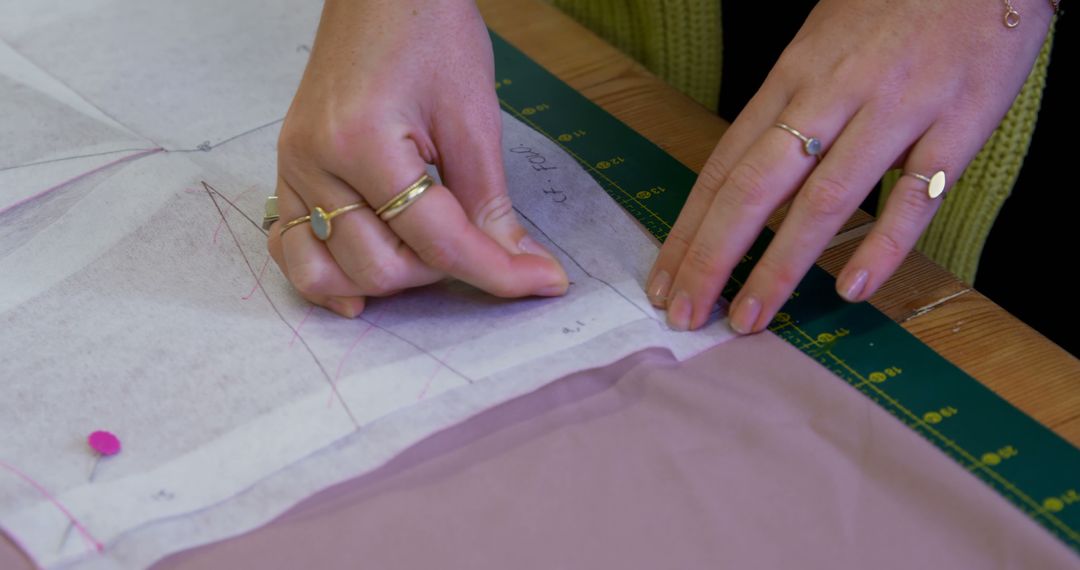 Close-Up of Person Marking Fabric with Pattern for Sewing Project - Free Images, Stock Photos and Pictures on Pikwizard.com