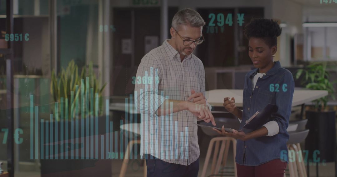 Diverse Colleagues Collaborating with Financial Data Insights in Office