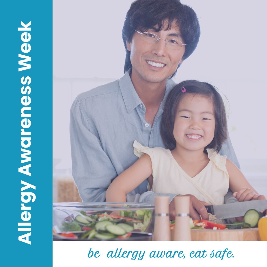 Smiling Asian Father and Daughter Preparing Salad for Allergy Awareness