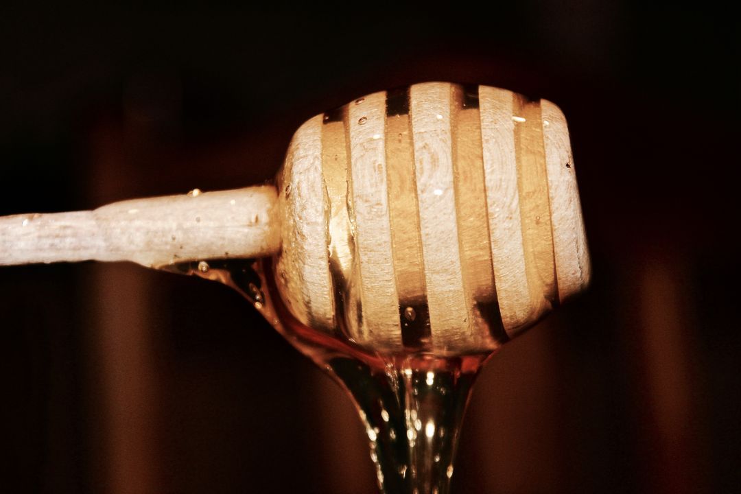 Close-up of Wooden Honey Dipper with Dripping Honey - Free Images, Stock Photos and Pictures on Pikwizard.com