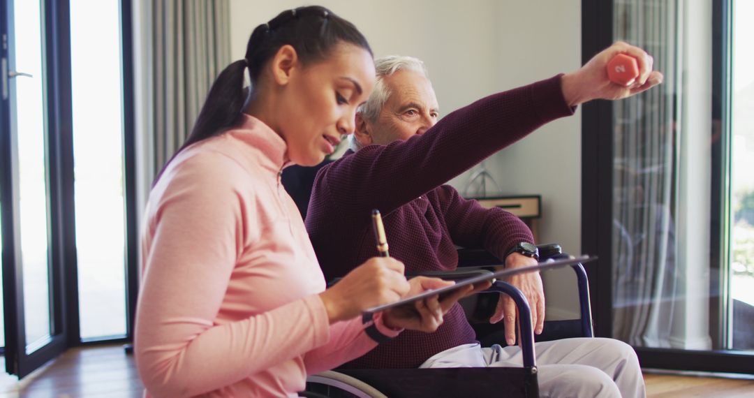 Young caregiver assisting elderly man during rehabilitation session - Free Images, Stock Photos and Pictures on Pikwizard.com