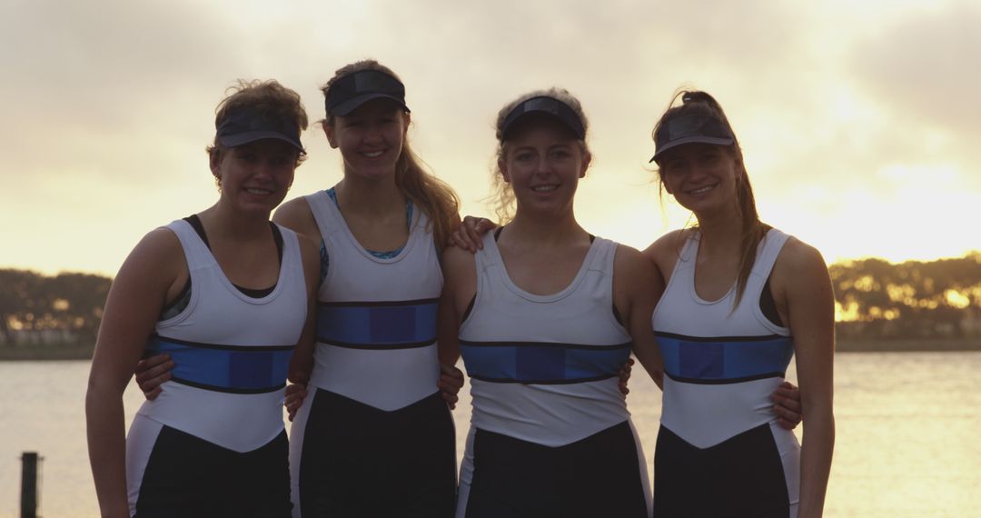 Four Female Rowers Standing Together at Sunset - Free Images, Stock Photos and Pictures on Pikwizard.com