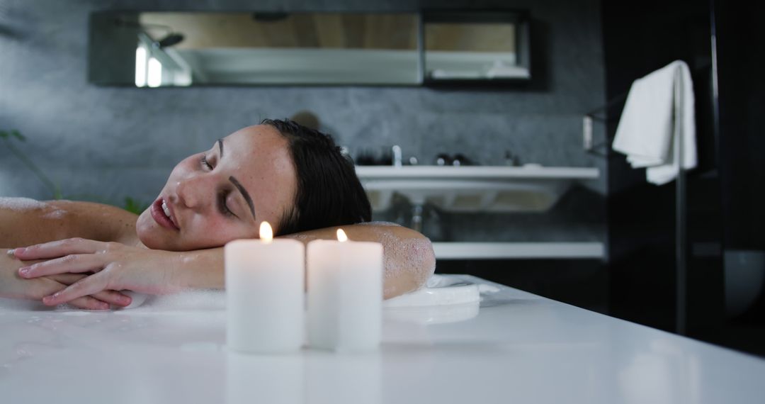 Young Woman Relaxing in Bath with Lit Candles - Free Images, Stock Photos and Pictures on Pikwizard.com