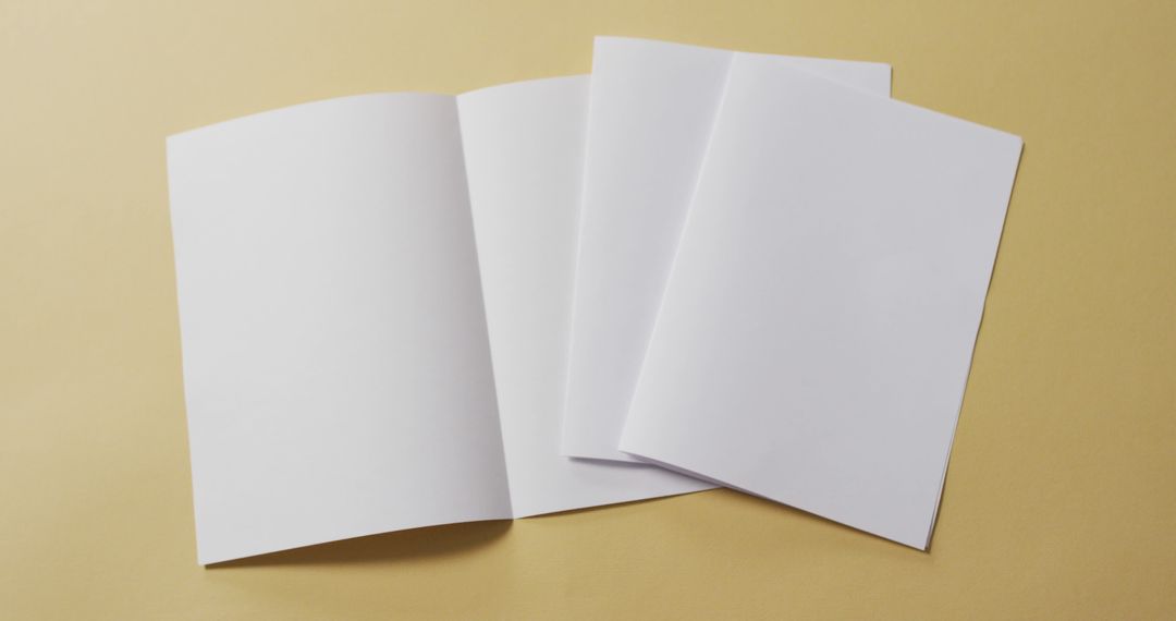 Image of white sheets of paper with copy space on yellow background - Free Images, Stock Photos and Pictures on Pikwizard.com