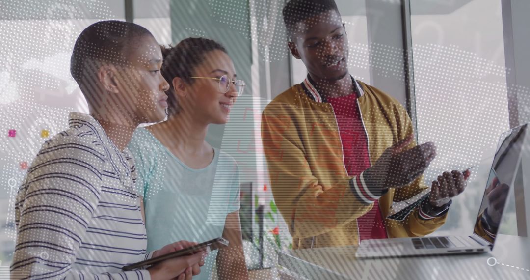 Dynamic Team Collaborating on Digital Project in Modern Office