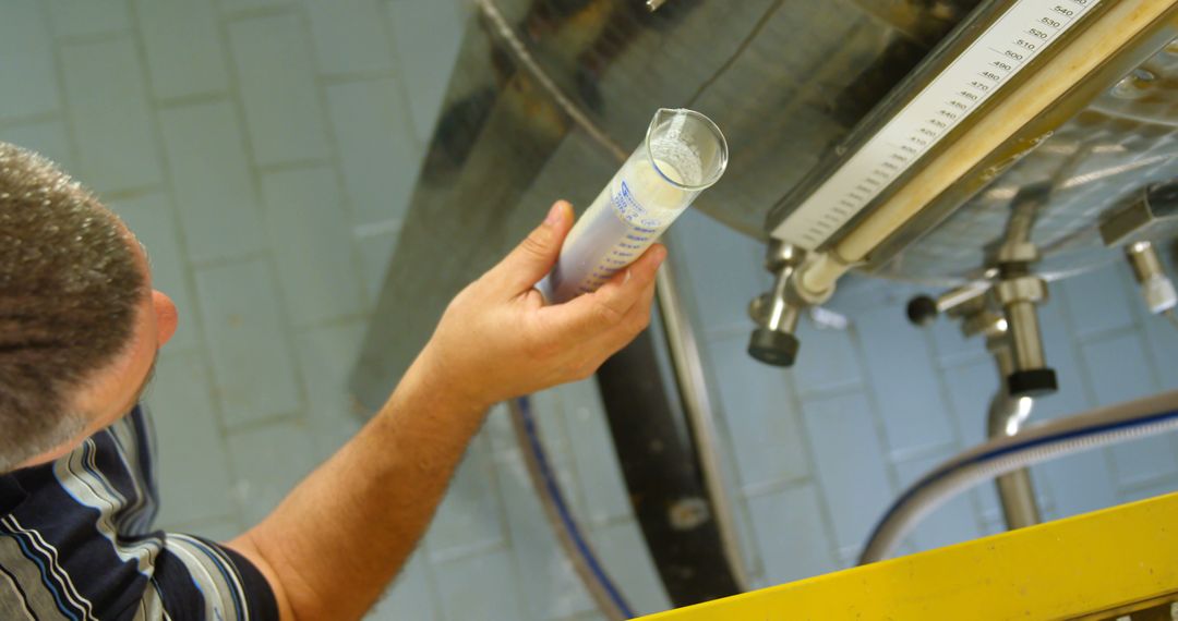 Worker Checking Chemical Solution in Laboratory Environment - Free Images, Stock Photos and Pictures on Pikwizard.com