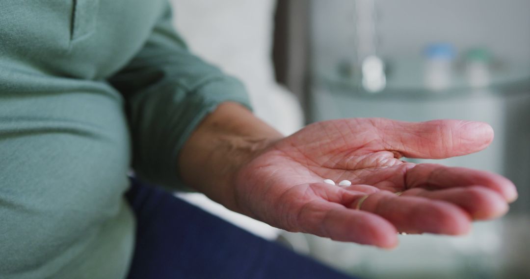 Senior Holding Medication Pills in Hand - Free Images, Stock Photos and Pictures on Pikwizard.com