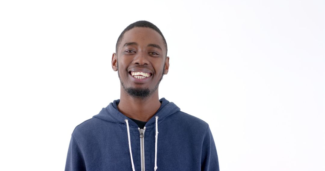 Cheerful Young Man Smiling in Casual Blue Hoodie