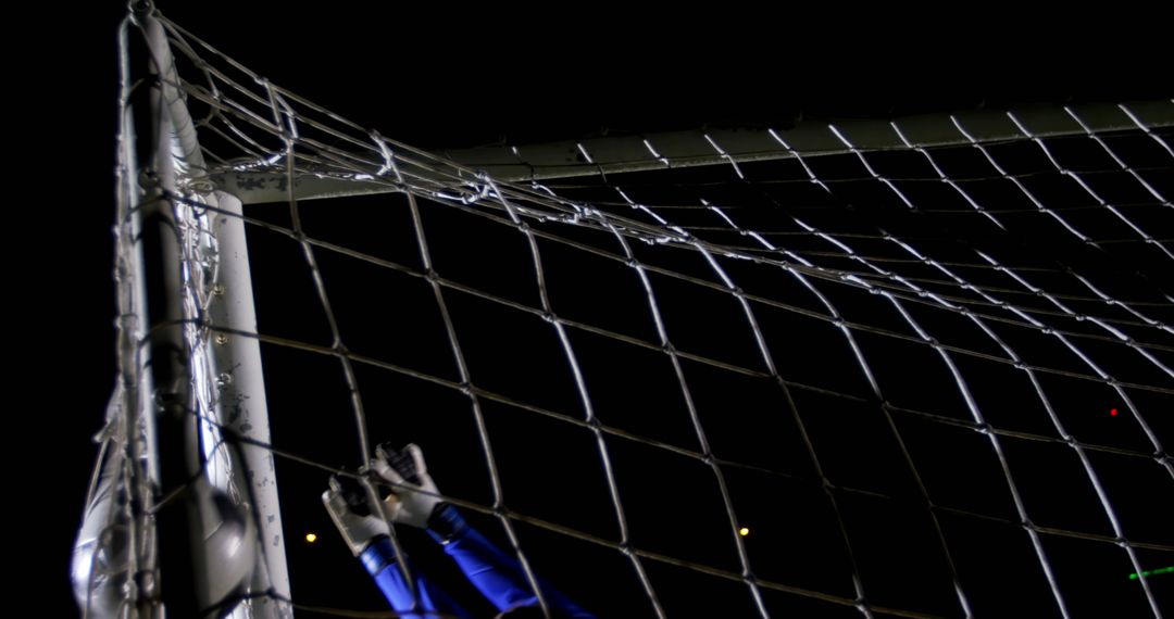 Goalkeeper making save during nighttime soccer match - Free Images, Stock Photos and Pictures on Pikwizard.com