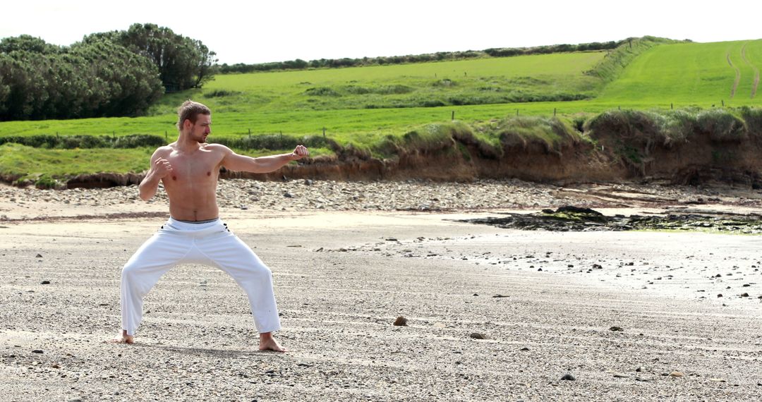 Shirtless Man Practicing Martial Arts on Beach - Free Images, Stock Photos and Pictures on Pikwizard.com