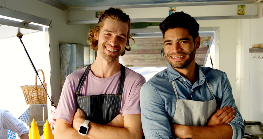 Two cheerful male small business owners standing in food truck kitchen - Free Images, Stock Photos and Pictures on Pikwizard.com