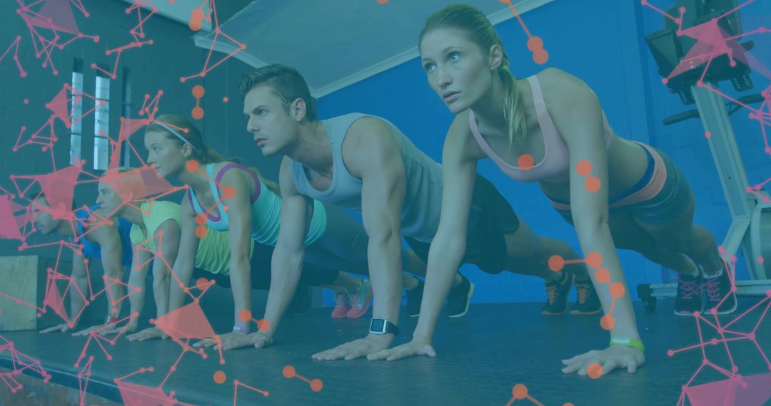 Group Performing Push-Ups Together in Gym Setting