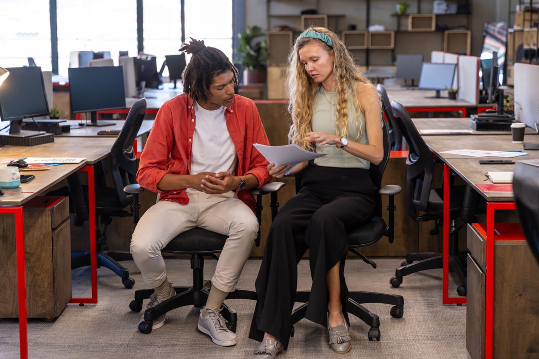 Diverse Team Collaborating in Open-Plan Office
