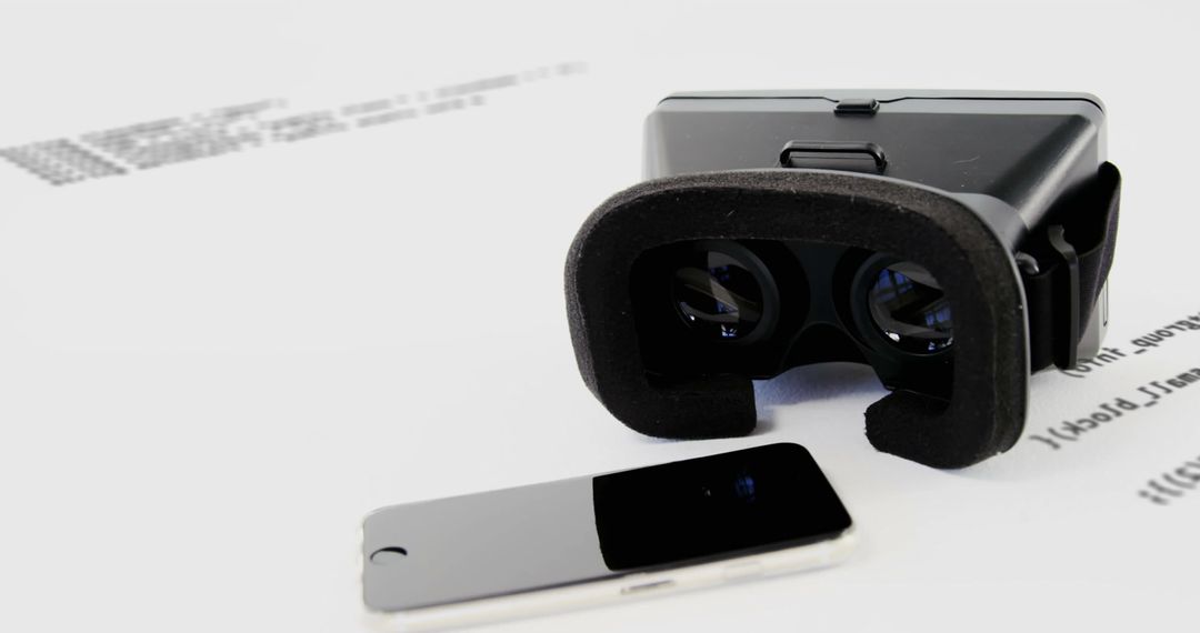 VR Headset Resting on Mobile Phone with Digital Data Graphics