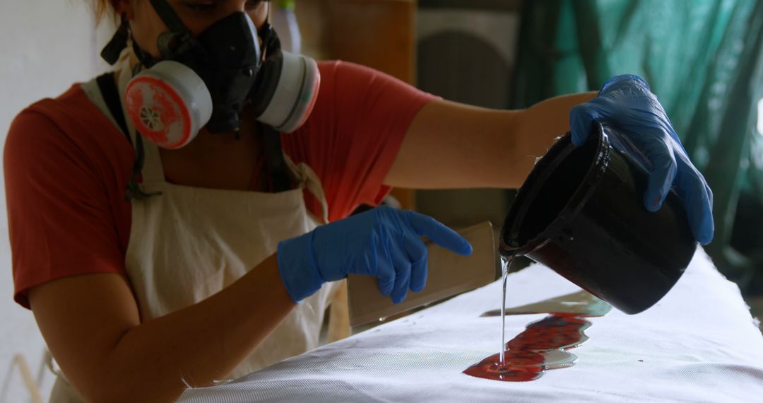 Female Artisan Pouring Resin Over Artist's Canvas - Free Images, Stock Photos and Pictures on Pikwizard.com