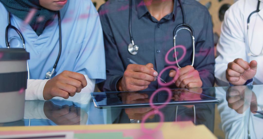 Medical Team Reviewing Patient Data on Tablet, Collaborative Healthcare Consultation