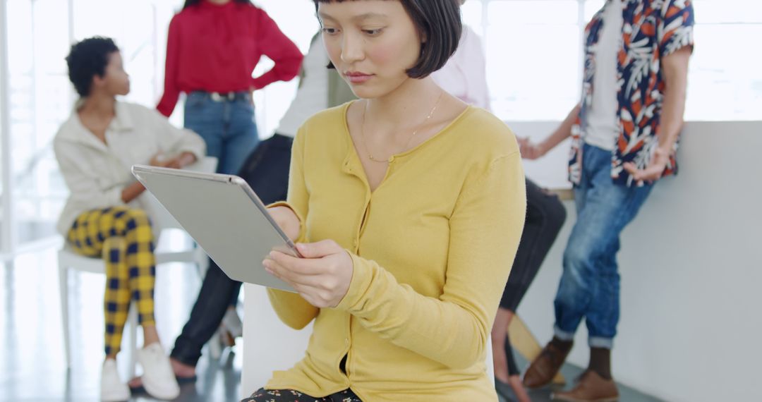 Businesswoman Using Digital Tablet in Modern Office Collaboration - Free Images, Stock Photos and Pictures on Pikwizard.com