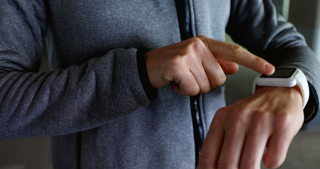 Person using smart fitness tracker on wrist - Free Images, Stock Photos and Pictures on Pikwizard.com