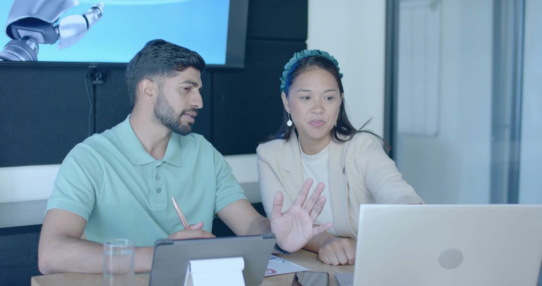 Collaborating in Modern Office with Laptop During Conference