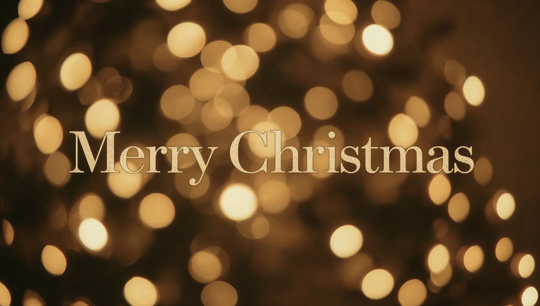 Merry Christmas gold serif typography with warm bokeh lights and festive metallic glow