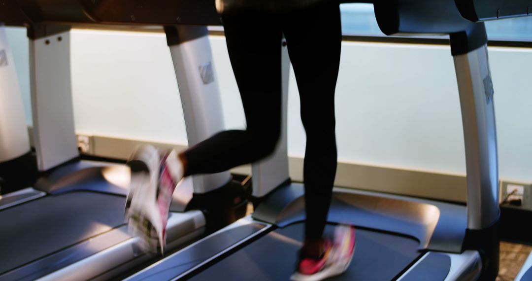 Person Running on Treadmill in Gym - Free Images, Stock Photos and Pictures on Pikwizard.com