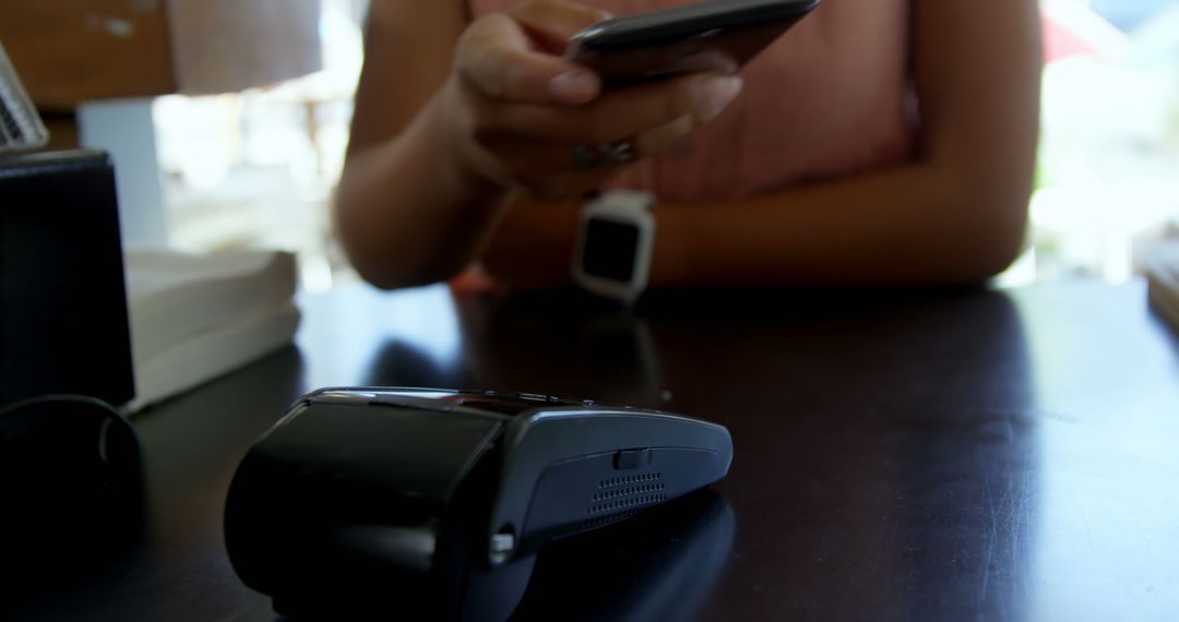 Close-up of a Woman Making Contactless Payment with Smartphone - Free Images, Stock Photos and Pictures on Pikwizard.com