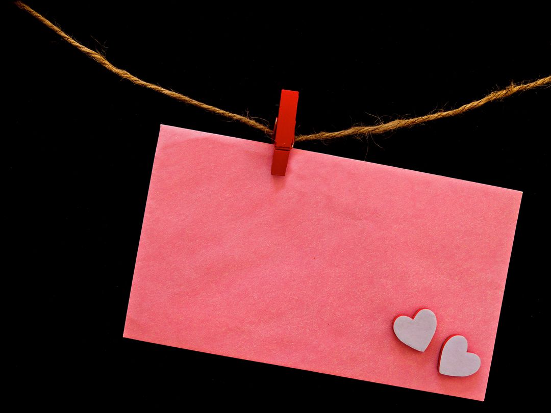 Red Envelope with Hearts on Clothesline for Romantic Messages