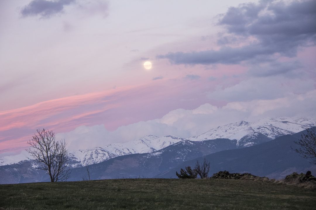 Serene Twilight Mountain Landscape with Full Moon and Snowy Peaks - Free Images, Stock Photos and Pictures on Pikwizard.com