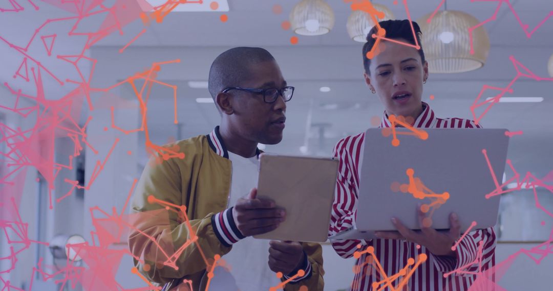 Collaborating Colleagues Analyzing Digital Strategy in Modern Office