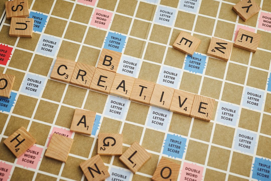 Scrabble Board with the Word 'Creative' in Focus