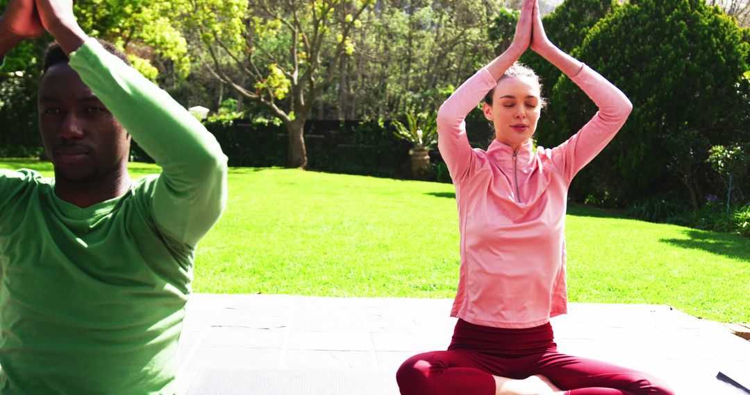 Diverse Couple Practicing Yoga Outdoors in Tranquil Garden - Free Images, Stock Photos and Pictures on Pikwizard.com