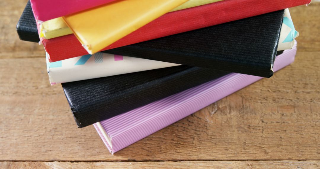 Colorful Textbooks Arranged on Wooden Table Close-Up - Free Images, Stock Photos and Pictures on Pikwizard.com