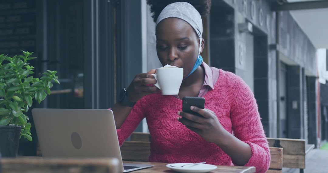 Woman Drinking Coffee While Using Smartphone at Outdoor Cafe - Free Images, Stock Photos and Pictures on Pikwizard.com