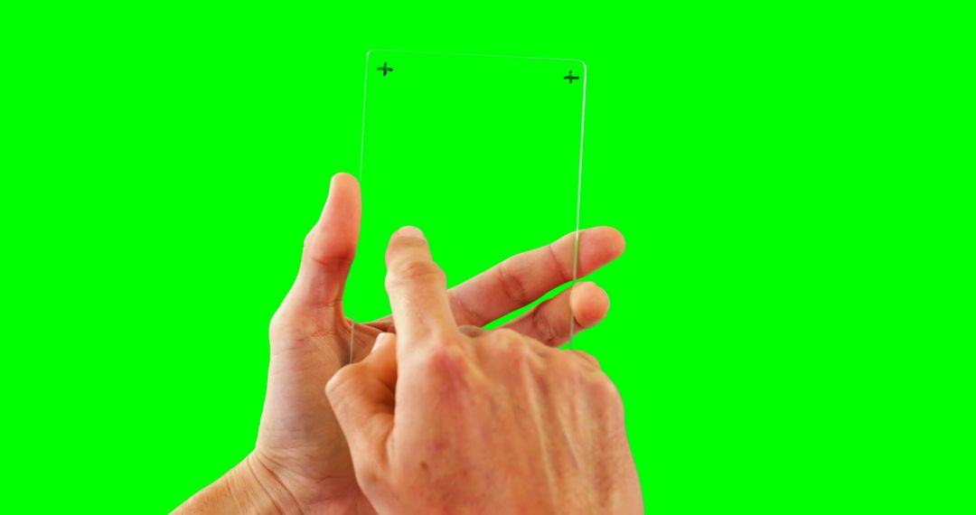 Person Holding Transparent Tablet with Touchscreen Against Green Background - Free Images, Stock Photos and Pictures on Pikwizard.com