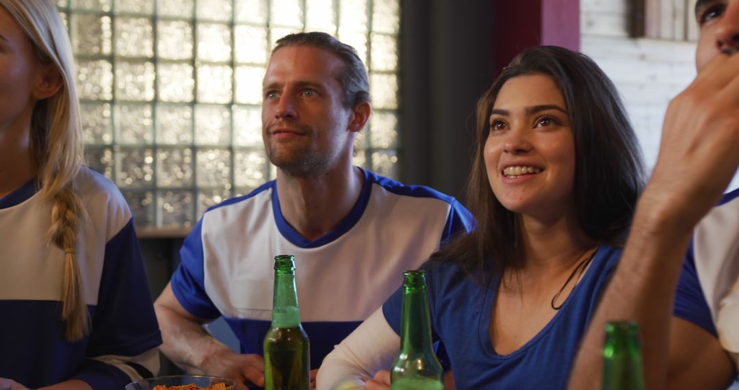 Diverse Group of Friends Watching Sports Enthusiastically