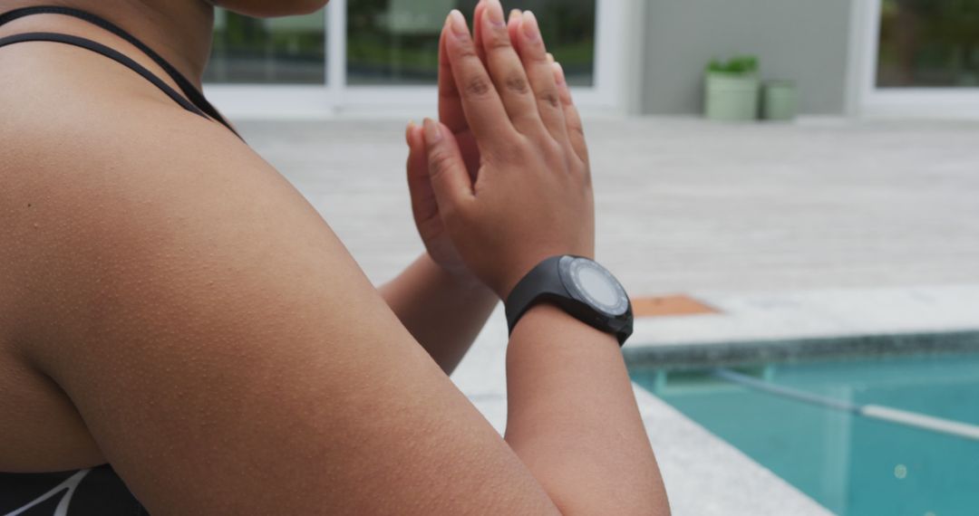 Person Meditating by Pool with Fitness Tracker - Free Images, Stock Photos and Pictures on Pikwizard.com