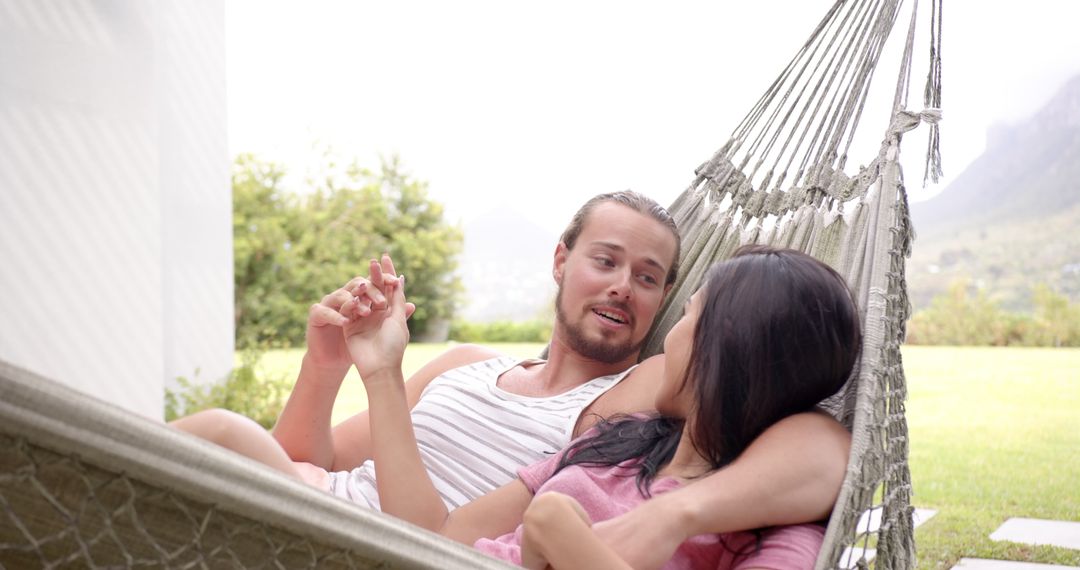 Relaxing Couple Enjoying Hammock Time in Sunny Backyard