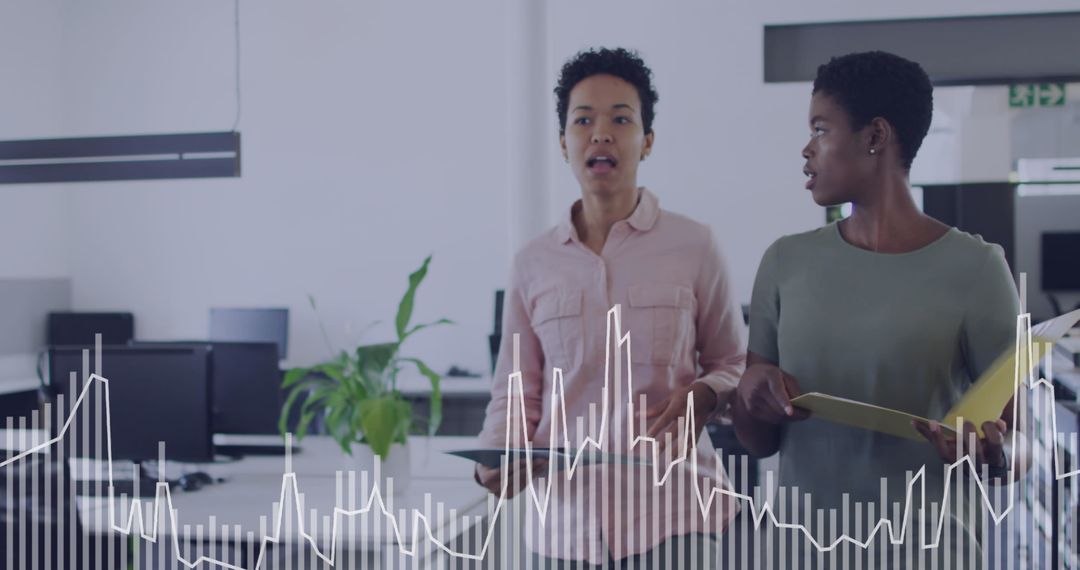 Diverse Team Analyzing Data in Modern Office Environment