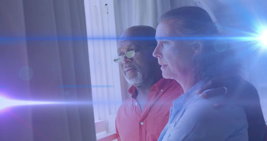 Elderly Couple Enjoying Serene Moment with Lens Flare