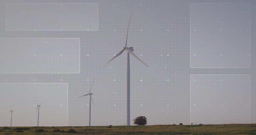 Wind turbine spinning on grassy plain with digital grid overlay and renewable energy