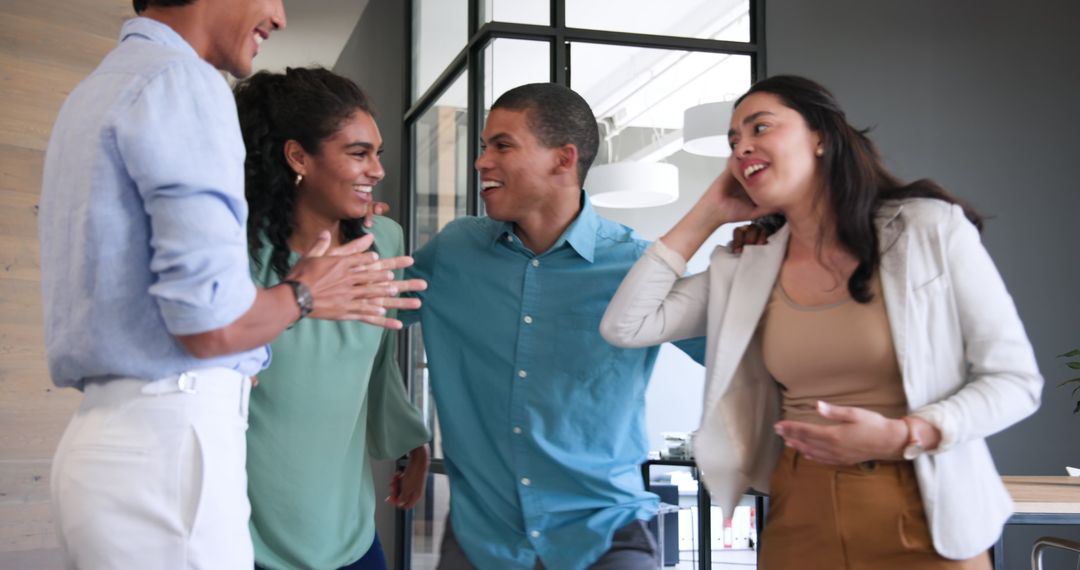 Multiracial Team Celebrating Success in Modern Office